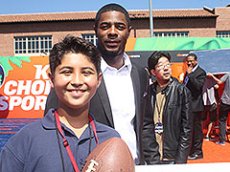 TFK Kid Reporter Lorenzo Blanco presents with New England Patriots soccer player Malcolm Butler.